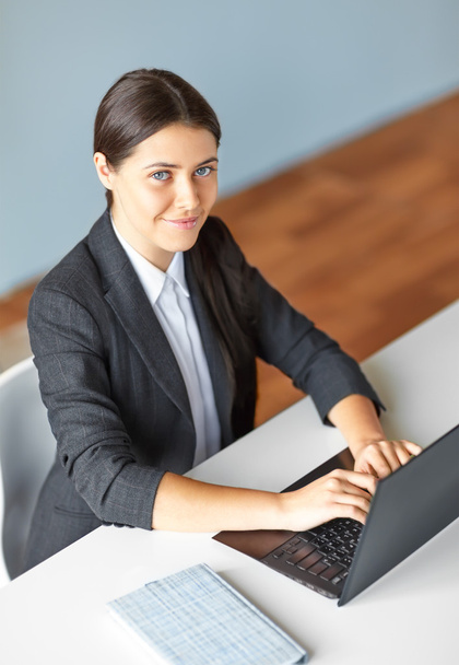 business woman with laptop in the office - Фото, изображение
