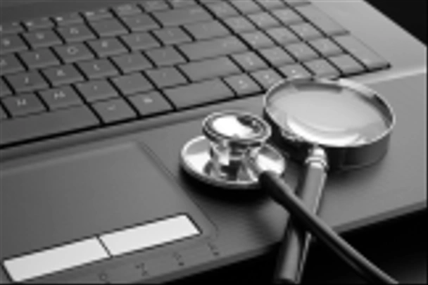 Stethoscope and magnifying glass on laptop - Photo, Image