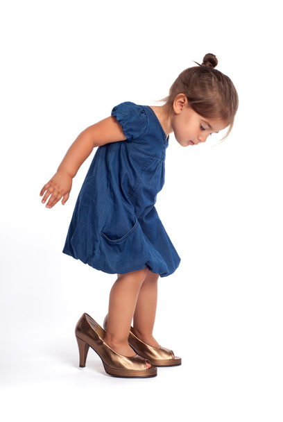 Little girl in high heel shoes - 写真・画像
