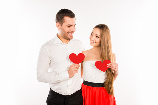 Two lovers holding red paper hearts - Valokuva, kuva