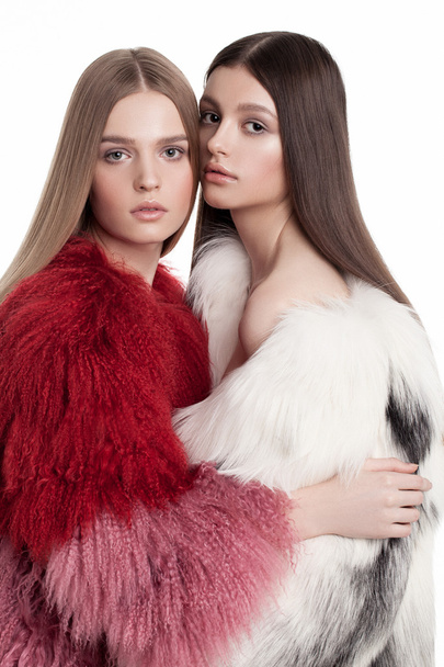 two models in fur coats posing - Φωτογραφία, εικόνα