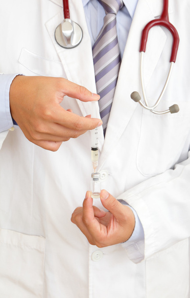 A doctor holding injector - Zdjęcie, obraz