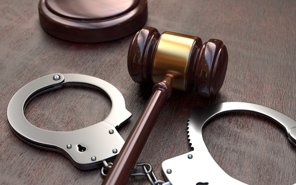  Gavel and handcuffs on wooden table background - Photo, image