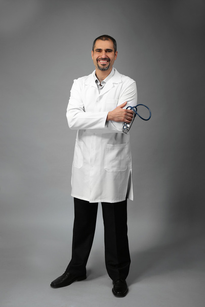 doctor on grey background - Valokuva, kuva