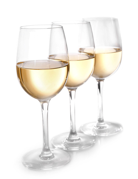 Three glasses of wine on light background - Foto, imagen