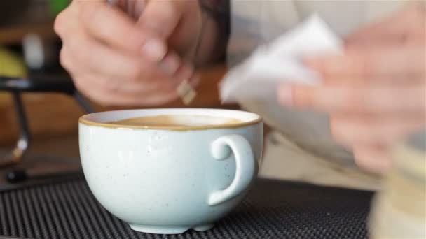 Hand of barista making latte - Filmati, video
