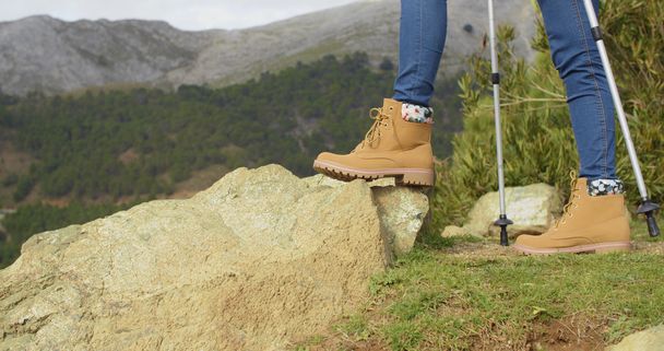 Person in hiking boots at mountains - Φωτογραφία, εικόνα