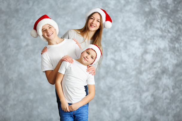 Boys and girl in Santa hats  - Foto, imagen