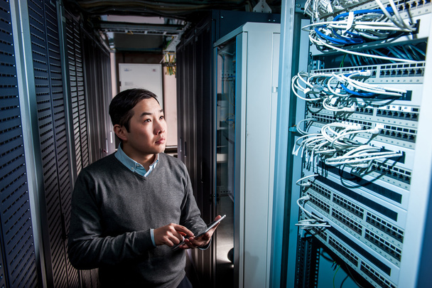 Young engineer businessman in server room - Photo, Image