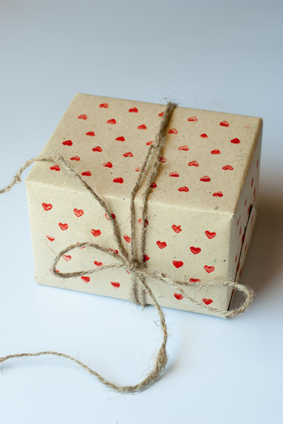 Gift in Handmade Paper with Red Little Hearts Pattern - Фото, изображение