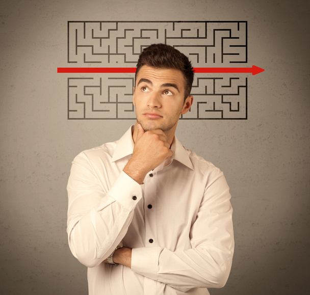 Handsome business guy solving maze - Photo, image