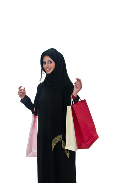 alışveriş torbaları tutan güzel Arap geleneksel kadın - Fotoğraf, Görsel