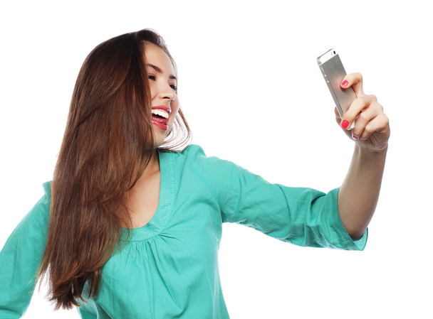 Pretty teen girl taking selfies - Фото, изображение