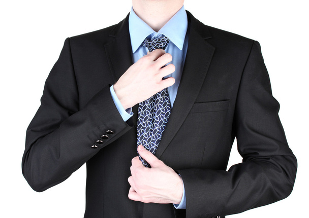 Businessman correcting a tie close up - 写真・画像