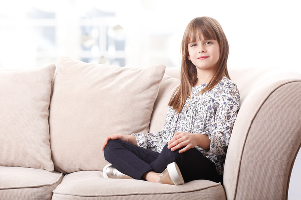cute girl sitting on  sofa - Фото, зображення