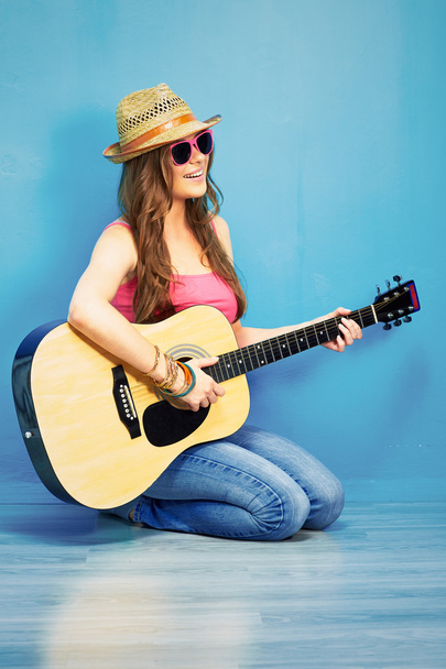 Woman sitting with guitar - 写真・画像