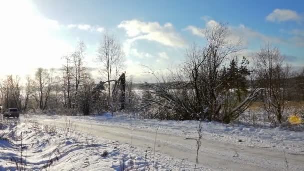Road on a Snowy Field in Cold Winter Day - Záběry, video