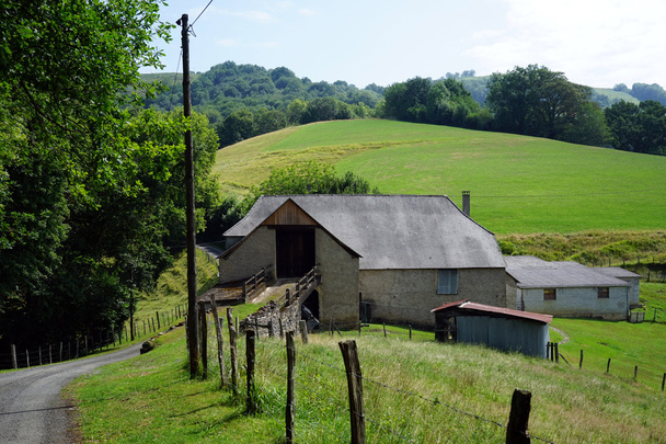 Farm and barn near green field in France - Фото, зображення