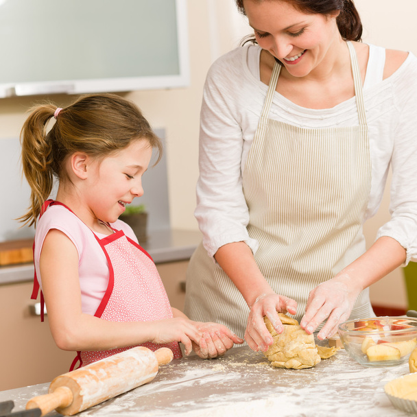 Mother and daughter prepare dough home cake - 写真・画像