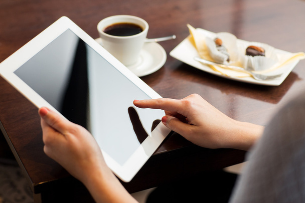 close up of woman with tablet pc and coffee - 写真・画像