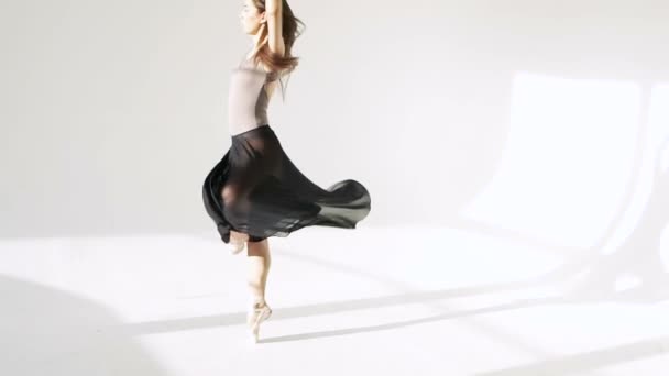 silhouette of ballerina in classical tutu in the white studio. - Video, Çekim