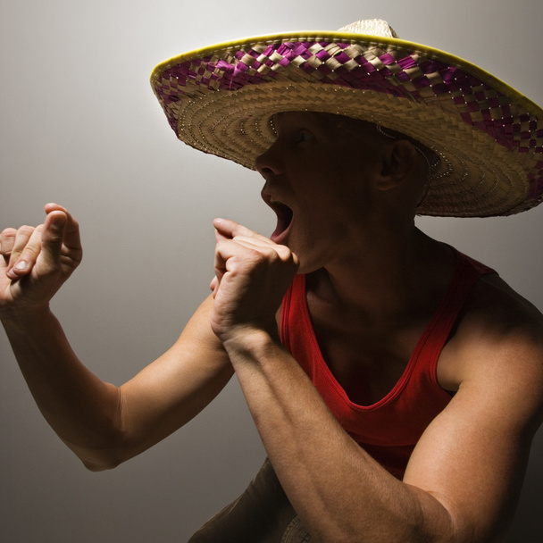 Dancing man wearing sombrero. - Foto, Bild