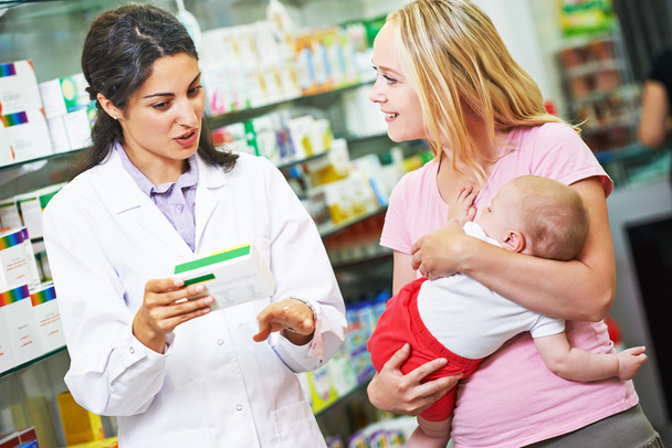 Pharmacy chemist, mother and child in drugstore - Fotó, kép