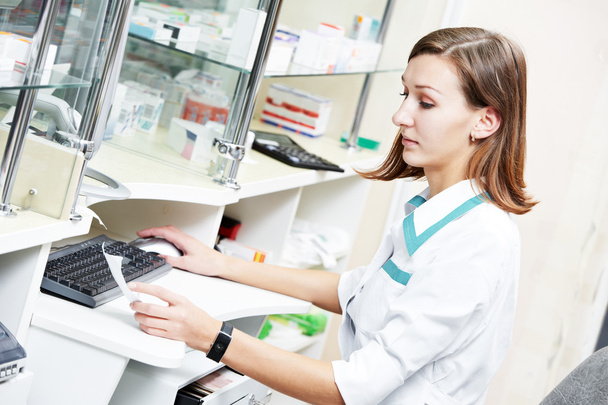 pharmacist chemist woman working in pharmacy drugstore - 写真・画像