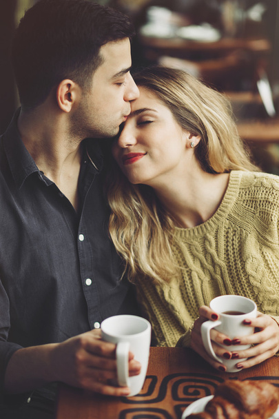 Couple in love drinking coffee in coffee shop - Zdjęcie, obraz