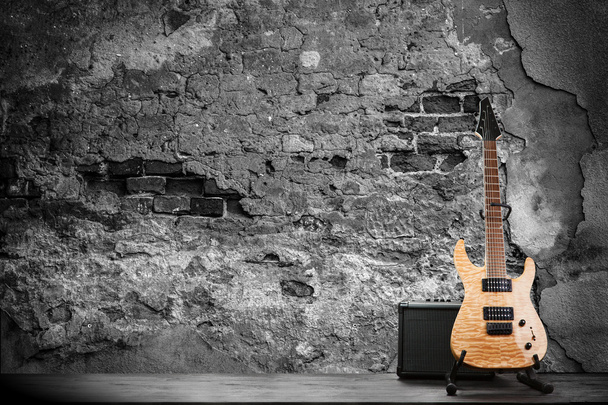 Electric guitar on a brick wall background - Photo, Image