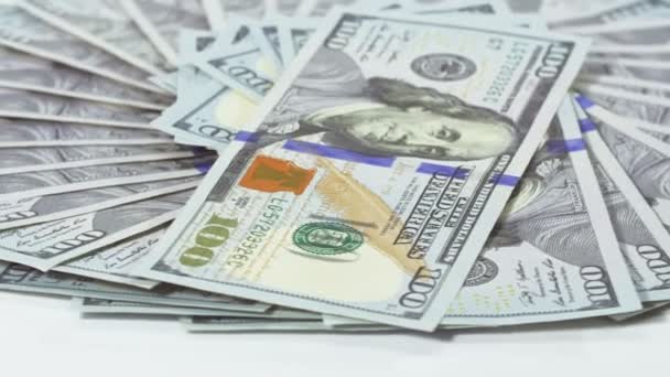 Mnoho 100 amerických dolarů bankovek rotující obchodní zázemí - Záběry, video