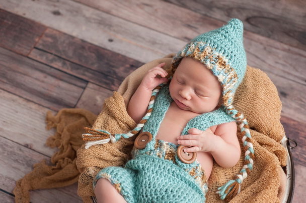 Newborn Baby Boy Wearing a Pixie Hat - 写真・画像