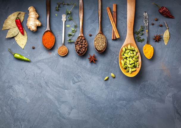 Various Spices near blackboard at blue stone background - Foto, imagen