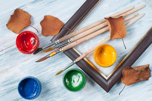 Paint brushes , paint and frame autumn - Фото, изображение