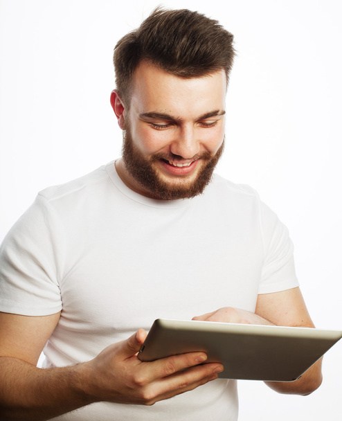 young man  using a tablet computer - Фото, изображение