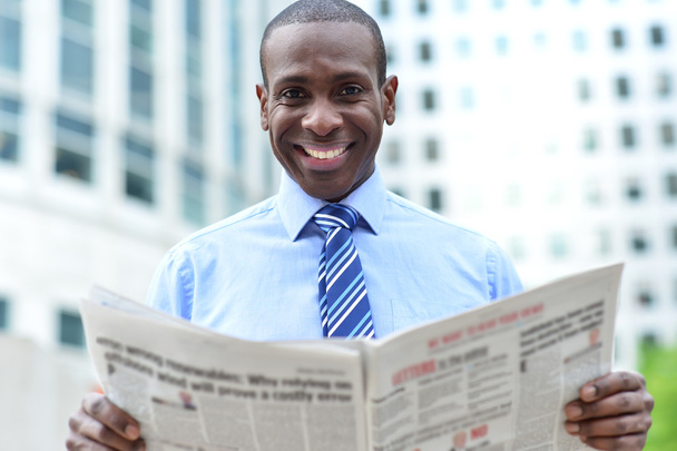 male executive with newspaper - Фото, изображение