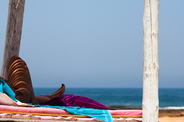 Resting woman at the Atlantic ocean beach - Fotoğraf, Görsel