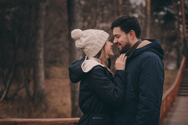 loving young couple happy together outdoor on cozy warm walk in forest - Foto, Imagen