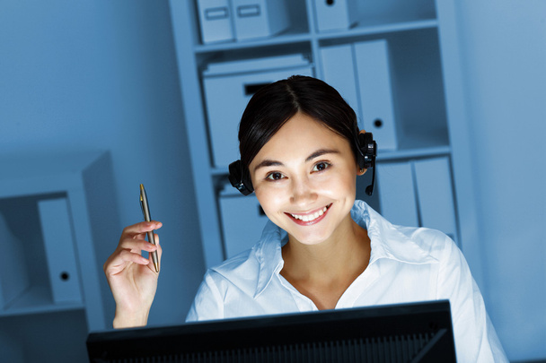 Young woman in business wear and headset - Photo, Image