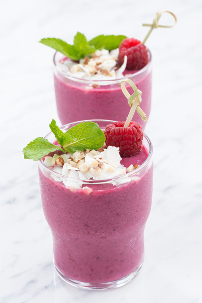 berry smoothie in a glass beakers, vertical - Fotó, kép