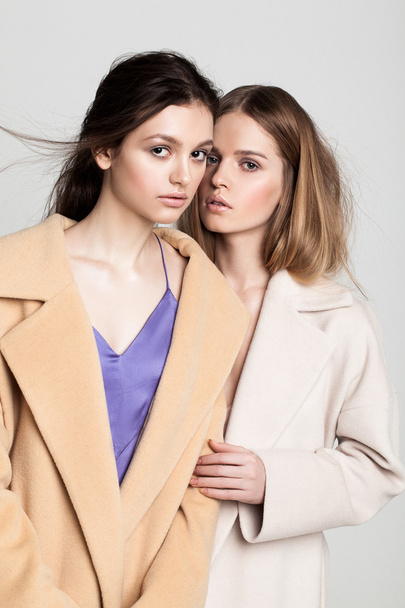 two models in fur coats posing - Foto, Imagen