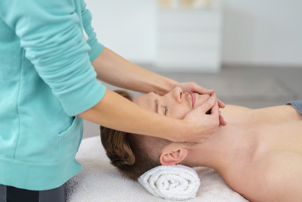 attractive man having a massage in a spa center - Foto, immagini