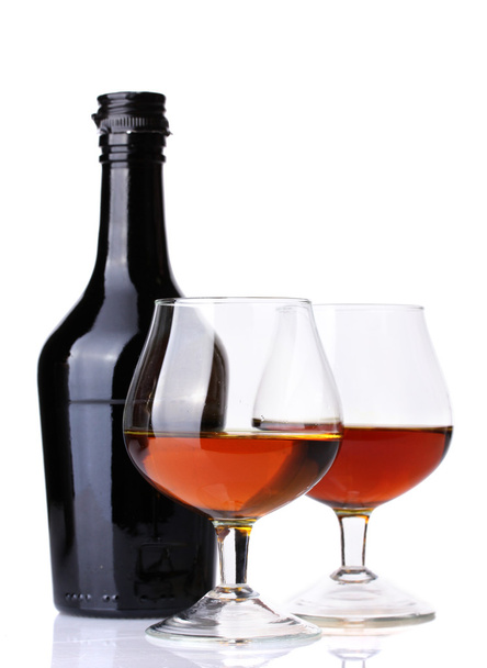 Glasses of brandy and bottle isolated on white - Foto, Imagem