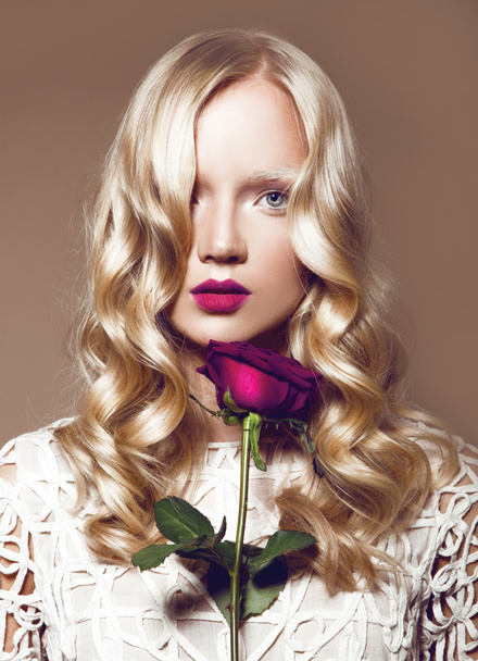 blond woman with flower - Fotó, kép