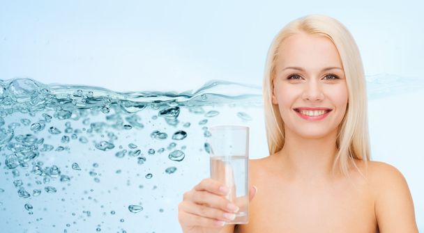 young smiling woman with glass of water - Fotografie, Obrázek