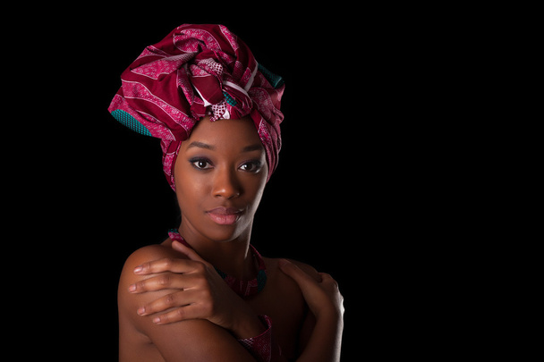 Young beautiful african woman wearing a traditional headscarf, I - 写真・画像