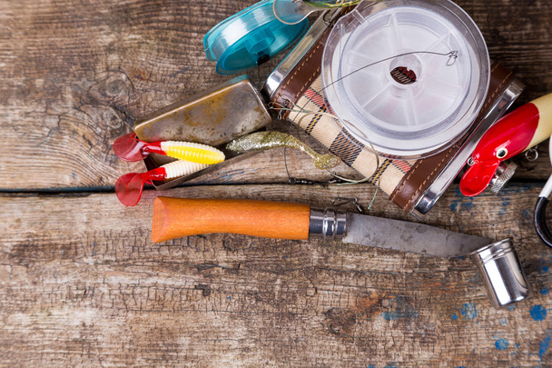 fishing tackles, baits, line with flask, knife and metal cup - Foto, Bild