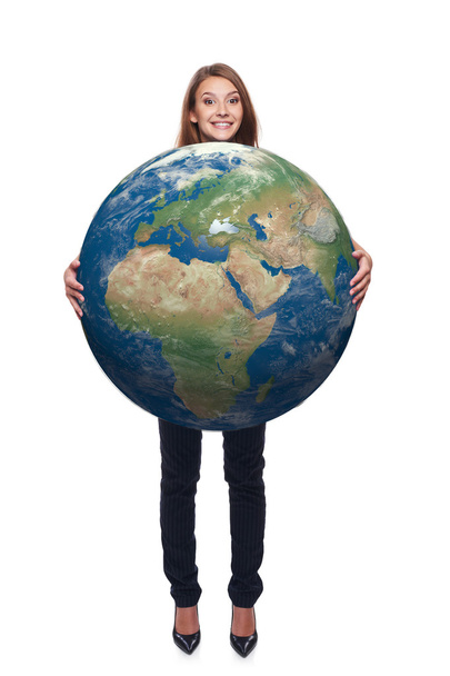 Woman in full length holding earth globe - Фото, изображение