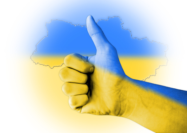 Pulgar hacia arriba con digital cuerpo pintado bandera de Ucrania
 - Foto, Imagen