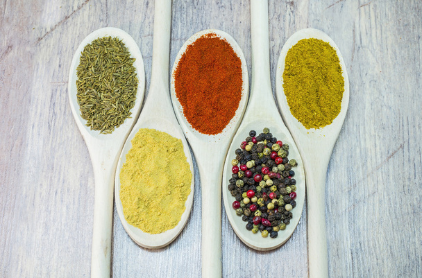 Spices on wooden spoon - Photo, Image